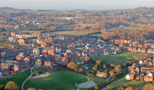 An aerial view picture of a housing estate on a sunny day.