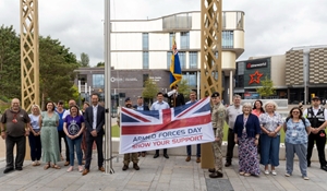 Telford & Wrekin Council staff and members of the Armed Forces raising the Armed Forces flag in Southwater Square.