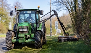 Machine cutting a grass verge