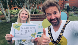 Mayor, Cllr Ian Preece, with a representative from Severn Hospice holding a sign saying 350,000 steps in 10 days. I'm ready!