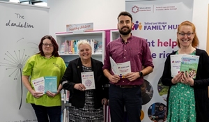 A group of people at the family hub drop-in session at Southwater Library