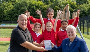 Richard Thorpe, Headteacher at Grange Park Primary School with a group of pupils and Councillor Shirley Reynolds