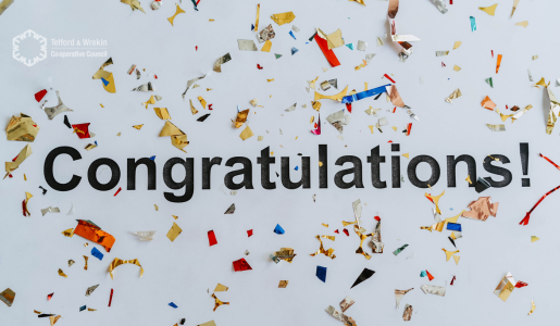 Congratulations wording with confetti behind on a pale off white background