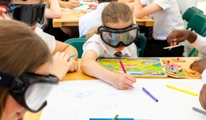 Children at Crucial Crew try on ‘beer goggles’ to experience the effects of too much alcohol.