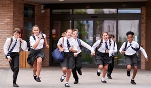 Group of school children running