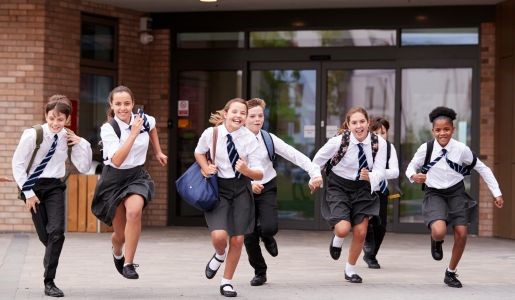 Group of school children running