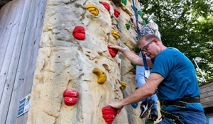 Councillor Paul Davis, Telford & Wrekin Council Cabinet Member for Communities and Civic Pride and Tracey Onslow, Assistant Police and Crime Commissioner, trying out the climbing wall at Telford Aerial Adventure, one of the activities on offer over October half-term.