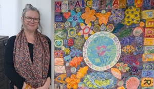 Pneuma Affinity Mosaic of Harmony photo 1, Project Leader Rosalyn Donati with the piece made by members of the Autism Hub