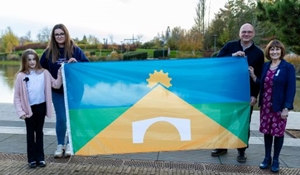 Amelia, Mum Jayne holding the winning flag with Councillor Lee Carter and Councillor Angela McClements