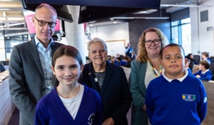 A group photo of schoolchildren and adults who took part in the school debate in the Council Chamber