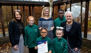 Pupils with from left to right: Michelle Salter, Virtual School headteacher, Jo Duncombe, headteacher at Woodlands Primary School and Councillor Shirley Reynolds