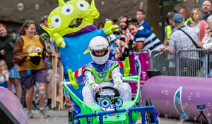 A character themed Toy Story cart with Alien behind