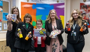Flag competition winner Amelia (centre) with from to right: Jayne, Amelia's Mum, Councillor Angela McClements, Lynda Stolic, Headteacher and Sam Stevens, class teacher