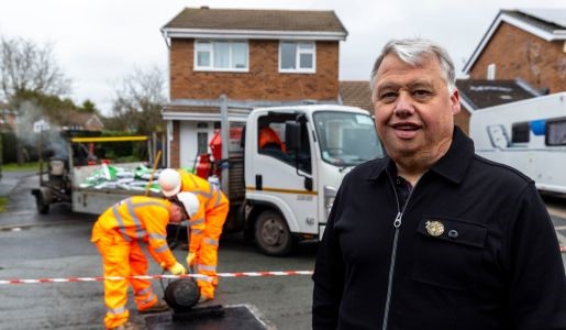 Cllr Richard Overton with reported pothole being filled