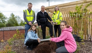 Councillor Richard Overton (centre) with James Aucote from Lovell (left) and Kirsty Liddell from Telford & Wrekin Council (right) with children from St George's Primary School