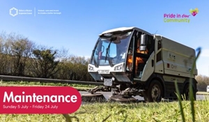 Road sweeper cleans side of road